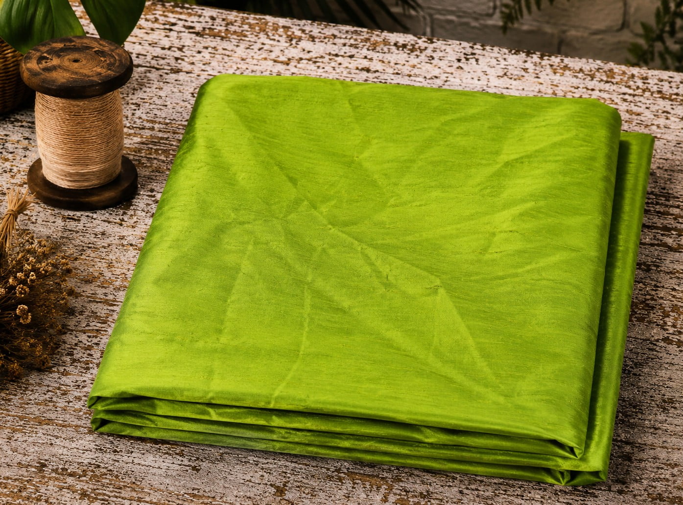 Lime Green Dupion Silk Fabric folded to showcase its vibrant citrus-green colour, natural silk texture, and luminous sheen