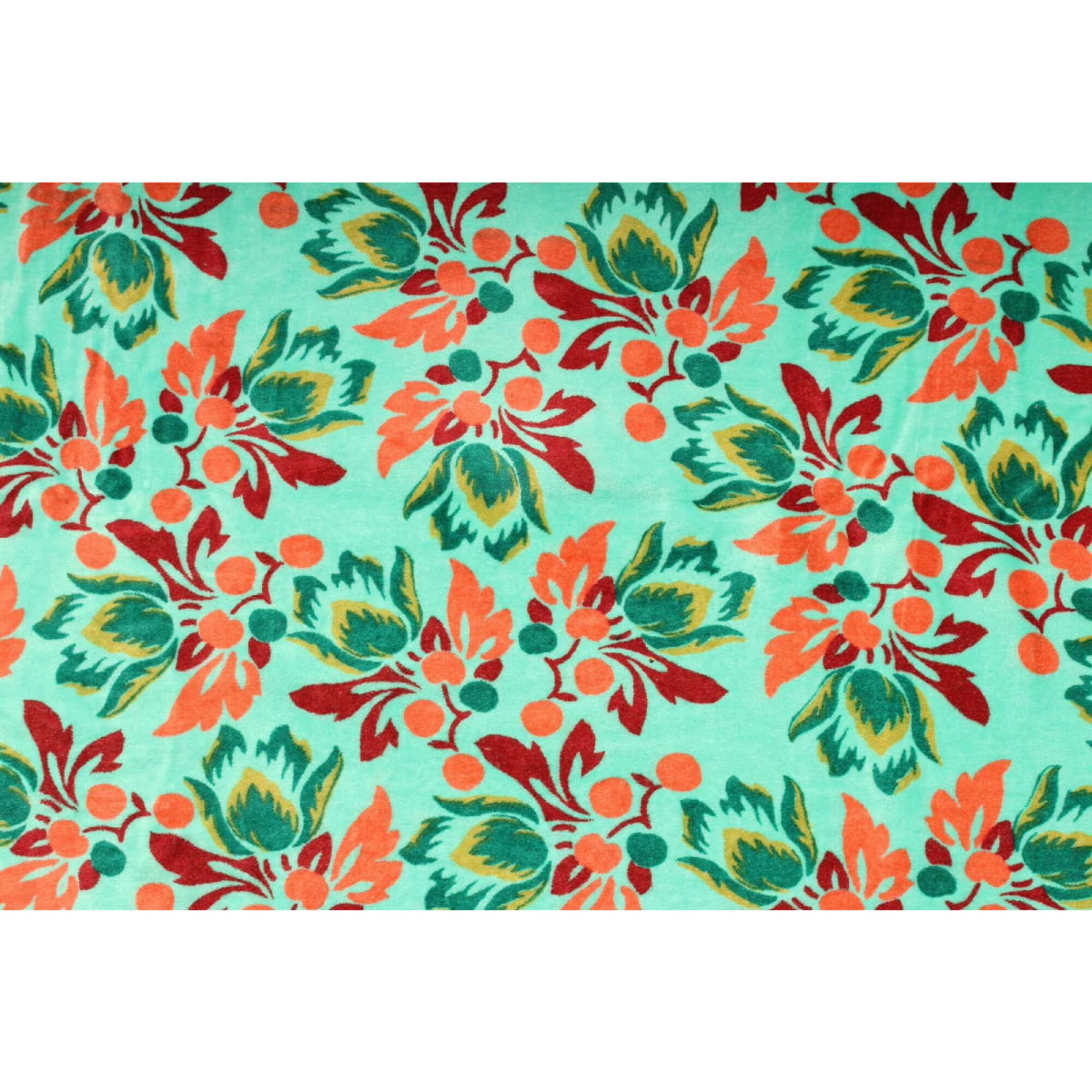 Close-up of red and orange floral pattern on green hand-printed cotton velvet
