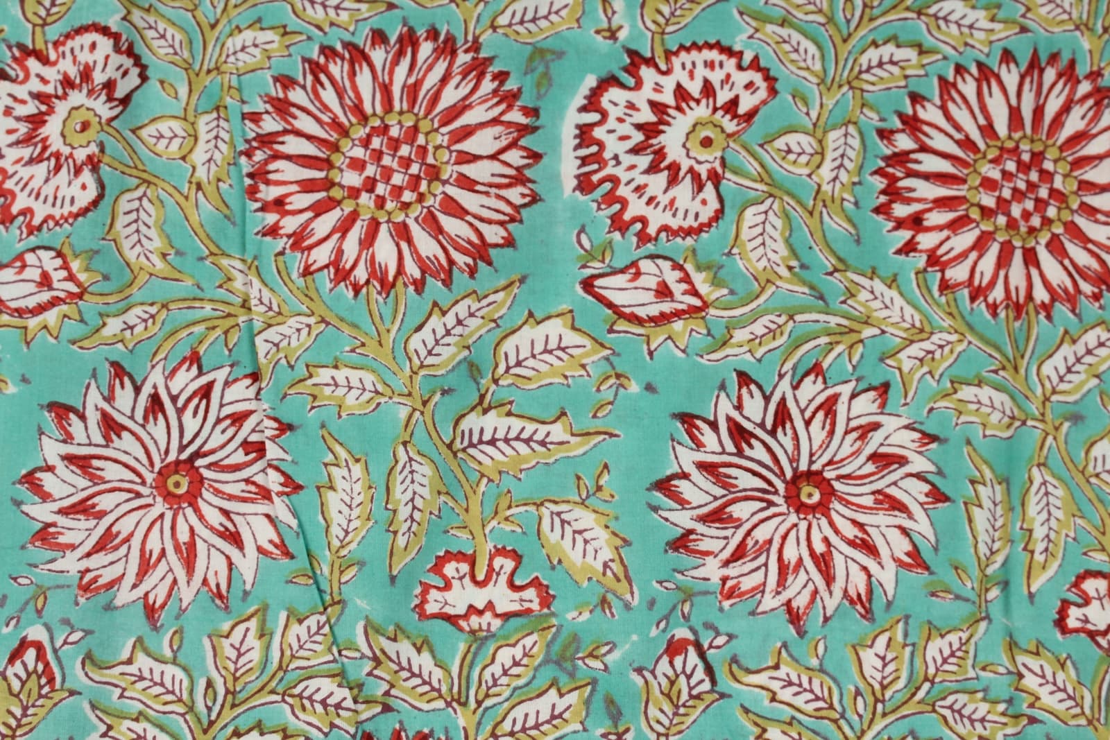 Close-up of Aqua Chrysanthemum Garden block printed cotton fabric showing chrysanthemum flowers and leafy vine details