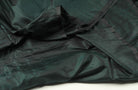 Draped Black Emerald dupion silk fabric displaying natural slub texture and colour-shifting sheen