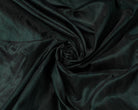Black Emerald dupion silk fabric arranged in a swirl showing iridescent black and emerald green raw silk texture