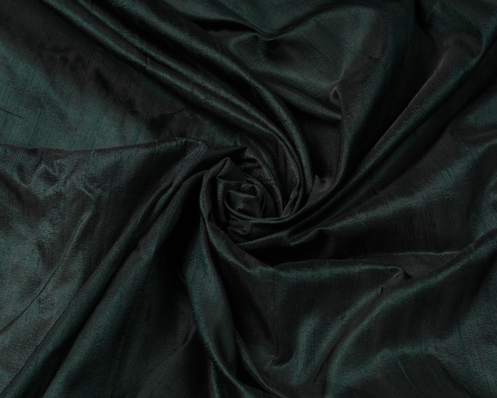 Black Emerald dupion silk fabric arranged in a swirl showing iridescent black and emerald green raw silk texture