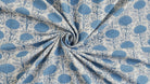 Powder blue block printed cotton fabric showing drape and texture