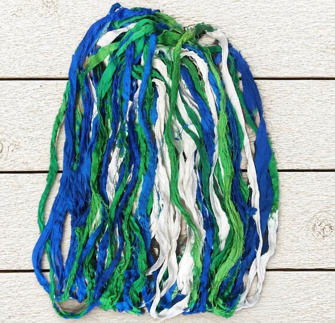 Ocean Breeze recycled sari silk ribbon yarn in cobalt blue, emerald green and white tones