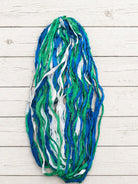 Long strands of Ocean Breeze sari silk ribbon yarn in blue, green and white colors