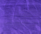 Close-up of Blue Violet Dupion Silk Fabric showing natural slub texture, woven silk detail, and rich violet-blue colour