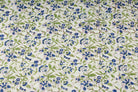 Bluebell Grove block printed cotton fabric showing repeating blue and green botanical pattern