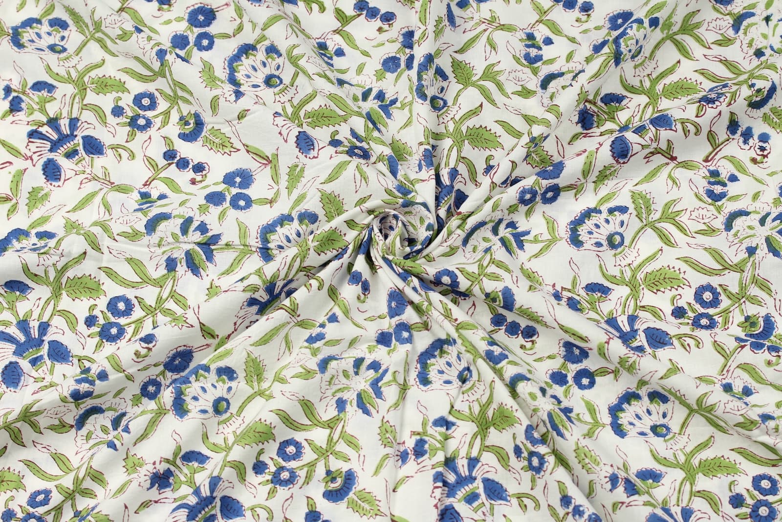 Bluebell Grove block printed cotton fabric draped to show texture, softness and movement