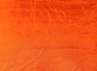 Close-up detail of Orange Dupion Silk Fabric surface texture