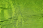 Close-up of Lime Green Dupion Silk Fabric showing natural slub texture, woven silk detail, and vibrant citrus-green colour