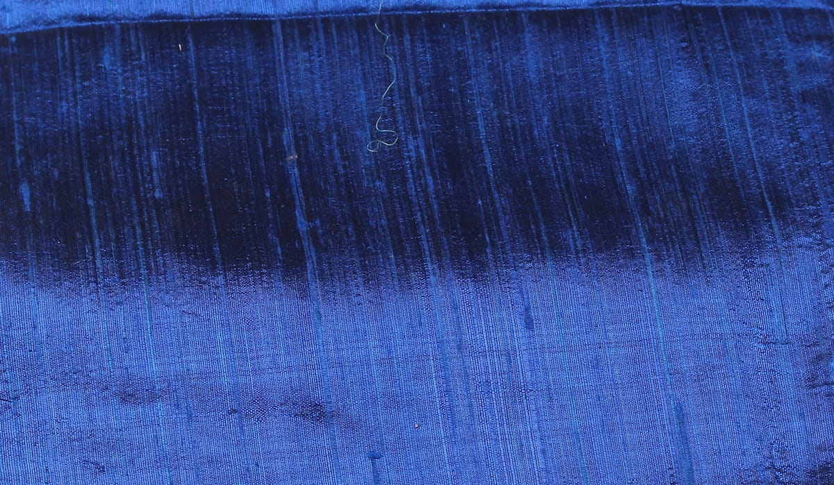 Close-up of Royal Blue Dupion Silk Fabric showing natural slub texture, woven silk detail, and vibrant sapphire-blue colour