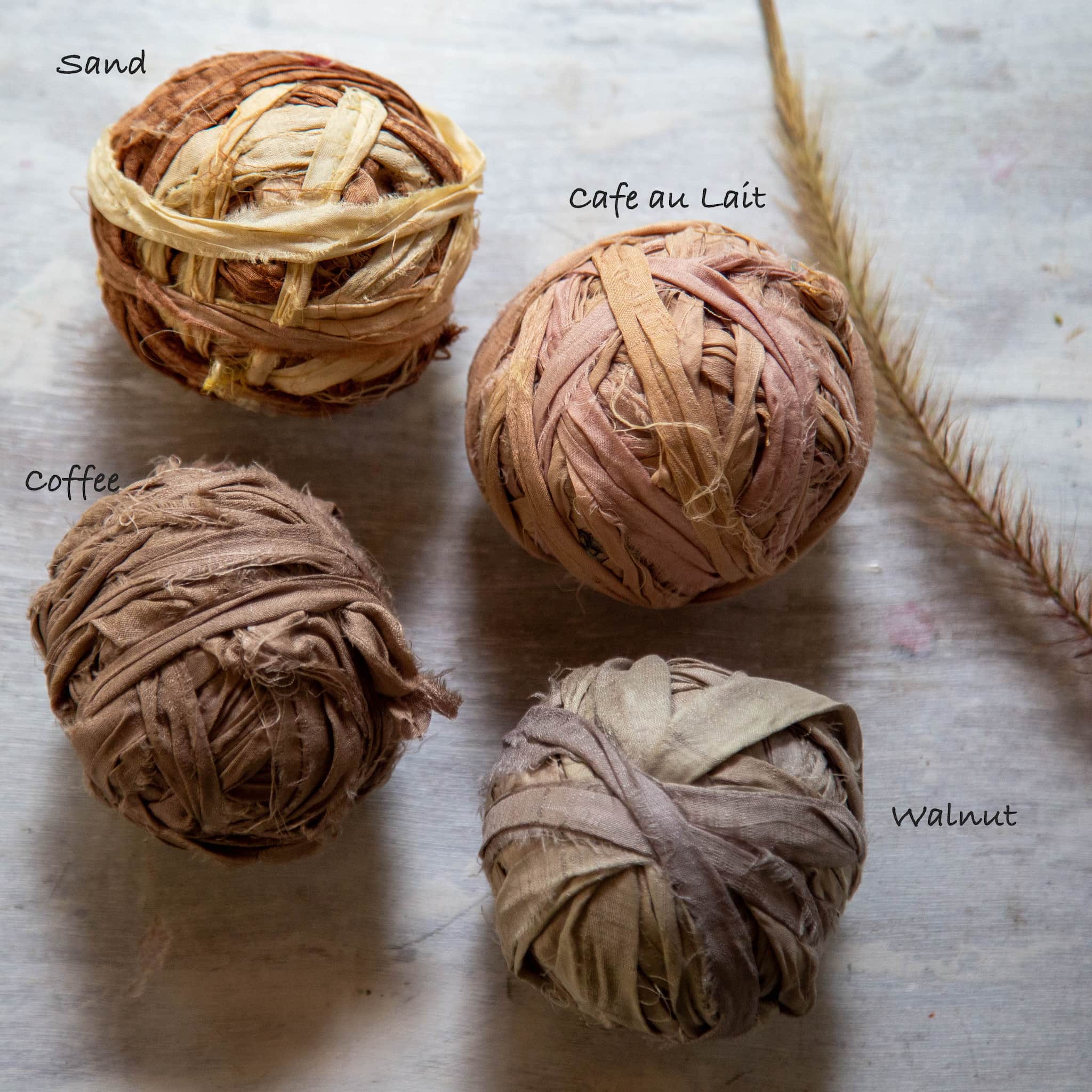 Coffee-colored upcycled Sari silk ribbon with frayed edges, suitable for boho decor.