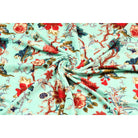 Folded turquoise velvet showing soft texture and floral detail