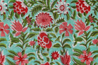 Close-up detail of Coral Wildflower Meadow block printed cotton fabric showing hand block printed floral motifs