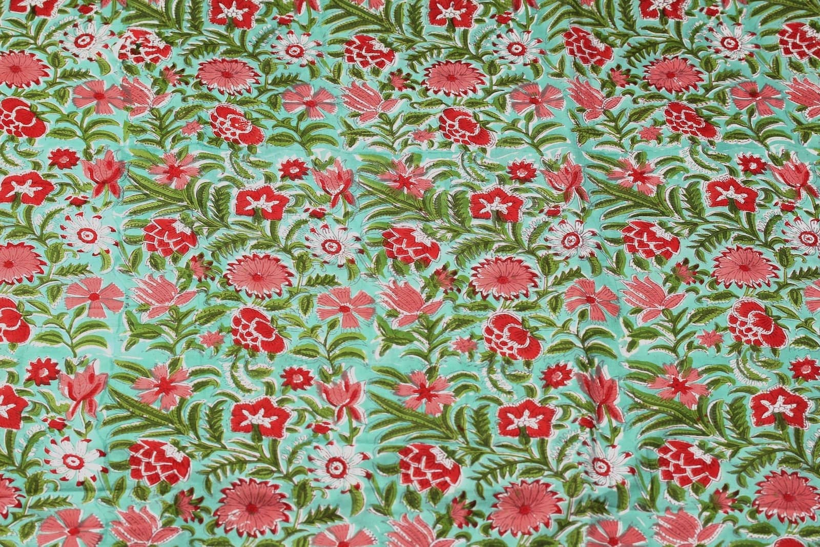 Coral Wildflower Meadow block printed cotton fabric showing full floral pattern repeat