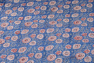 Cornflower Dahlia hand block printed cotton fabric featuring red and ivory dahlia flowers on a cornflower blue background