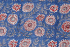 Close-up of Cornflower Dahlia block printed cotton fabric showing detailed floral motifs and trailing vine patterns