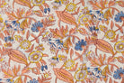 Close-up detail of Cornflower Daisy Trail block printed cotton fabric showing blue flowers and yellow daisies