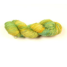 Cotton Linen Yarn – “Lime Grove” in bright yellow and green tie-dye tones, soft hand-dyed yarn on white surface.
