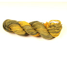Cotton Linen Yarn – “Olive Dusk” shade with yellow, green, and black tie-dye tones, soft natural fiber yarn.