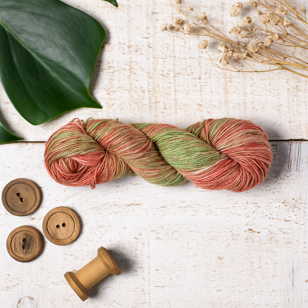 Hand-dyed Cotton Linen Yarn – Autumn Field shade in orange, green, and off-white tones styled image