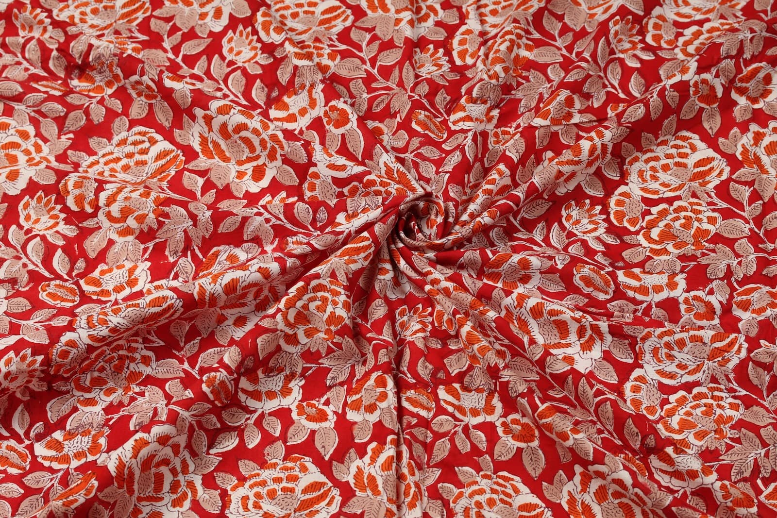 Crimson Rosewood floral block print cotton fabric gathered to showcase drape and texture