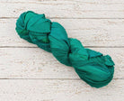 Emerald chiffon silk ribbon yarn single skein in rich jewel green