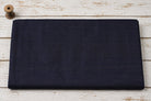 Deep Navy Dupion Silk Fabric folded to display its rich midnight blue colour, natural silk texture, and elegant sheen