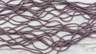 Close up texture of dusty mauve sari silk cord made from recycled silk