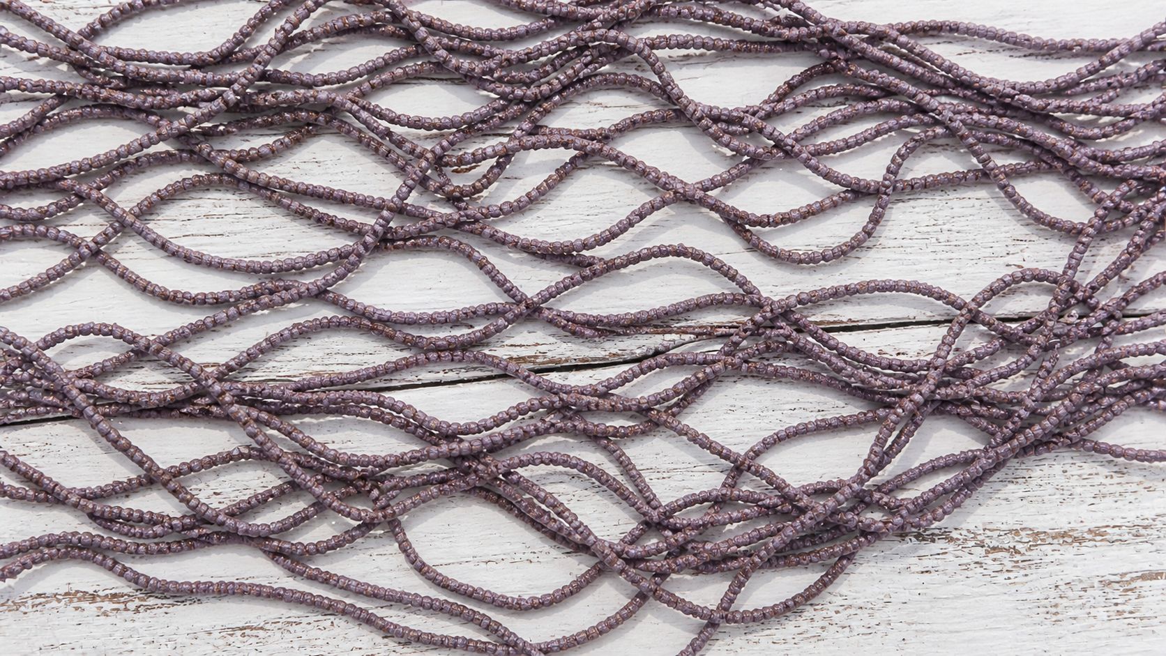 Close up texture of dusty mauve sari silk cord made from recycled silk