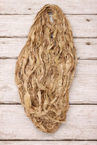 Camel recycled sari silk ribbon showing natural texture and frayed edges