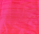 Close-up of Electric Fuchsia dupion silk fabric showing raw silk texture and vivid pink colour with lustrous finish