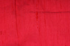 Close-up of Electric Pink Dupion Silk Fabric showing natural slub texture, woven silk detail, and rich colour variation
