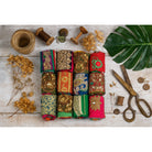 Flatlay of embellished Saree Silk Ribbon rolls in multiple vibrant designs