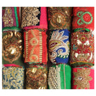Styled shot of embellished Saree Silk Ribbon rolls showing unique designs