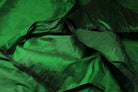 Close-up of Emerald Green Dupion Silk Fabric showing natural slub texture, woven silk detail, and rich emerald green colour