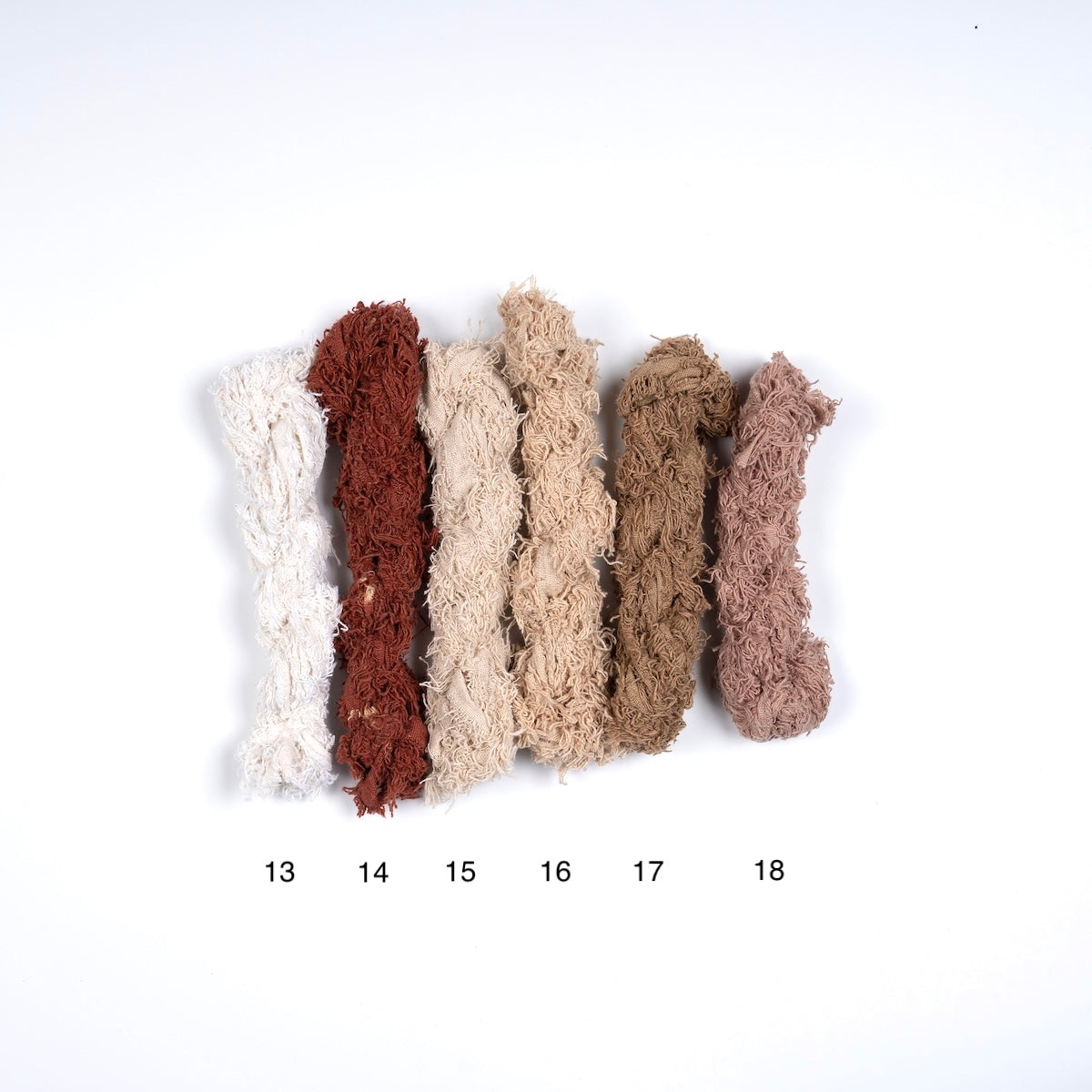 Fuzzy cotton ribbon in ivory, beige, and brown shades for crafting and DIY projects