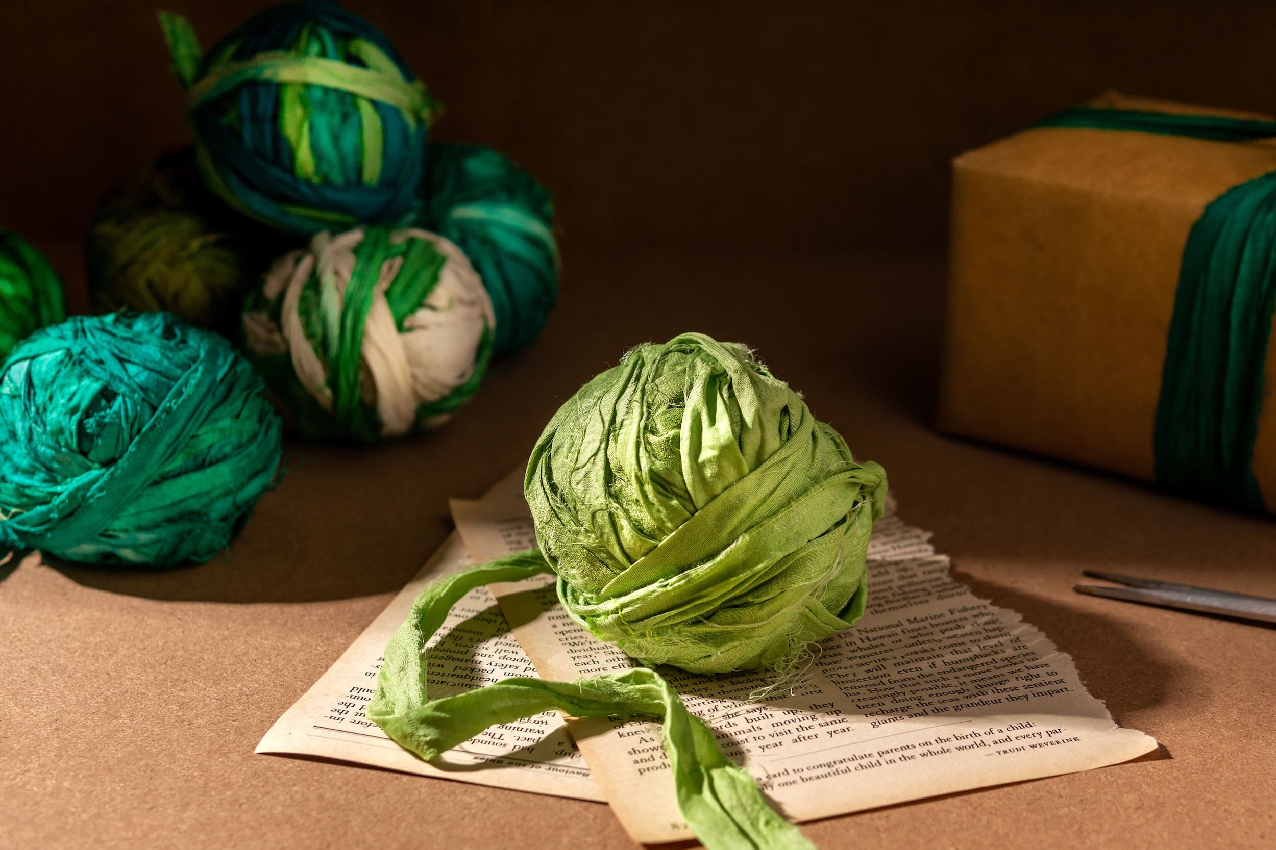 Bundle of green silk ribbons with various hues, perfect for floral design, gift wrapping, and creative projects.
