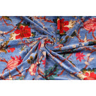 Folded sky-blue cotton velvet showing soft pile and floral design