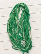 Hand dyed Spring Fern sari silk ribbon yarn draped to display texture