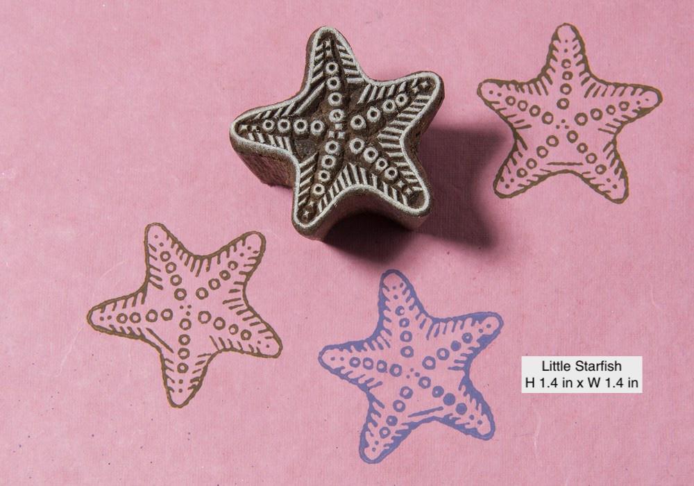 Small hand-carved starfish wood block stamp with a delicate design