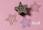 Small hand-carved starfish wood block stamp with a delicate design