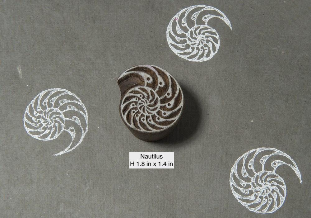 Detailed spiral nautilus wood block stamp hand carved in India for textile and pottery decoration.
