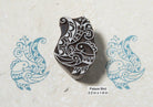 Traditional Indian palace bird wood printing block with ornate folk design printed in blue ink.