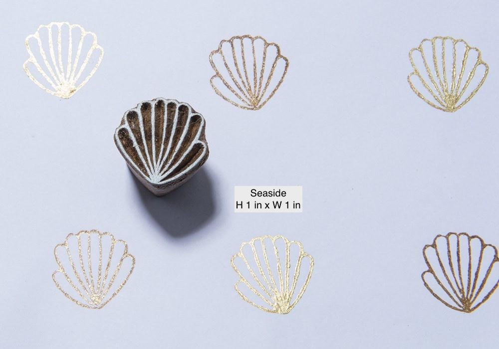 Small hand carved wooden seashell stamp used for fabric and paper printing