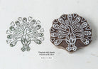 Hand carved peacock with hearts wooden block printing stamp shown with printed impression on paper.