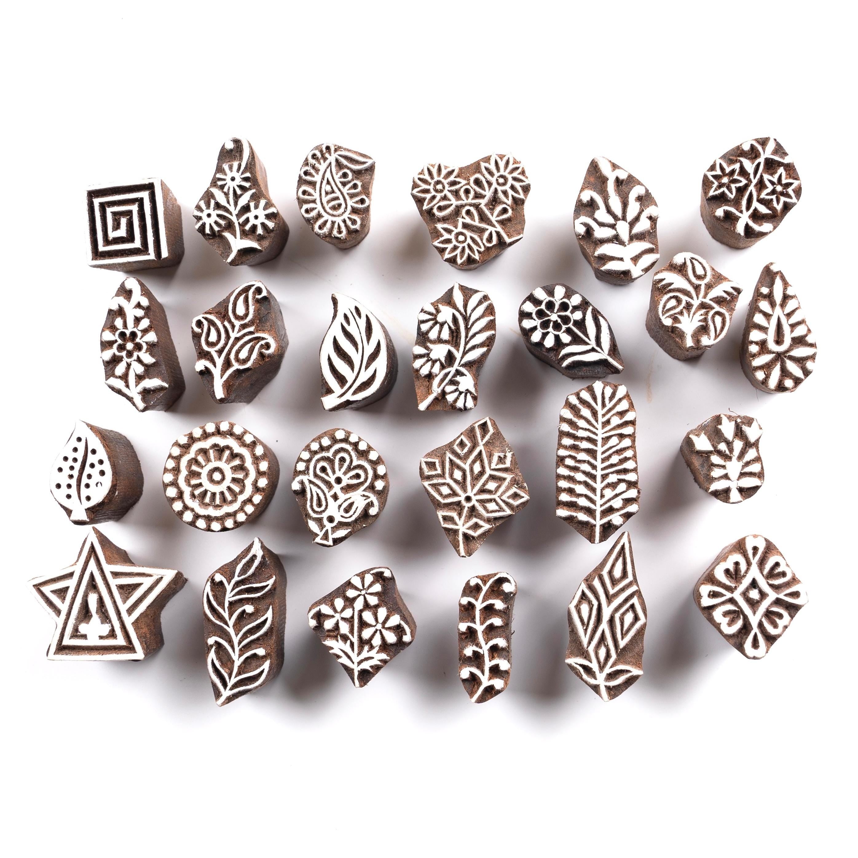 Set of 25 tiny hand carved Indian wooden block printing stamps featuring floral, leaf, paisley and geometric motifs