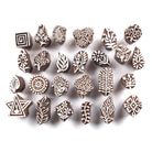Set of 25 tiny hand carved Indian wooden block printing stamps featuring floral, leaf, paisley and geometric motifs