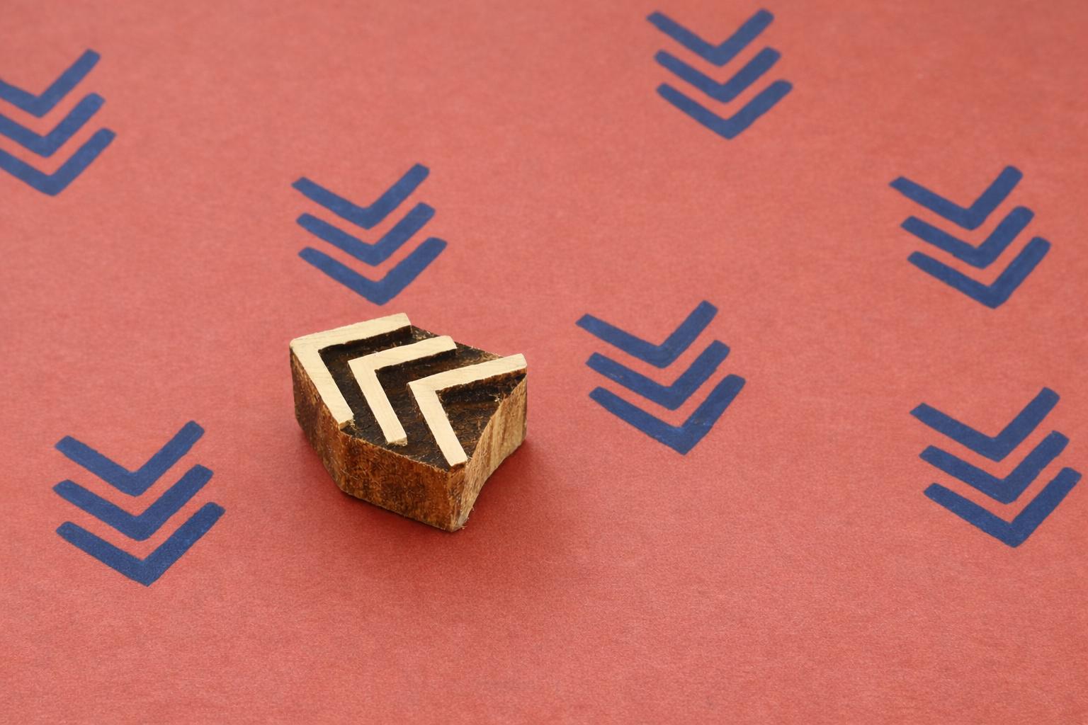 Hand carved triple chevron wooden block stamp printing blue geometric pattern