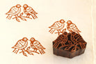 Hand carved wooden love birds printing block with brown stamped pattern on fabric